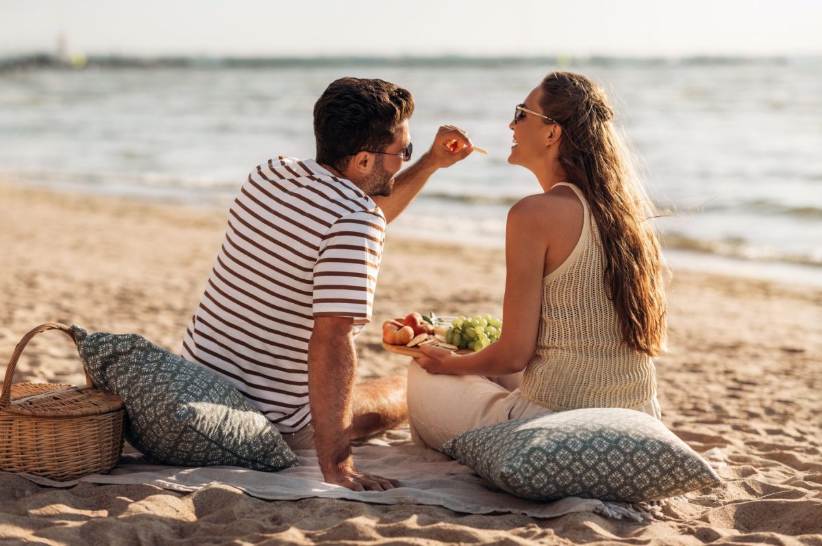 couple having picnic on beach